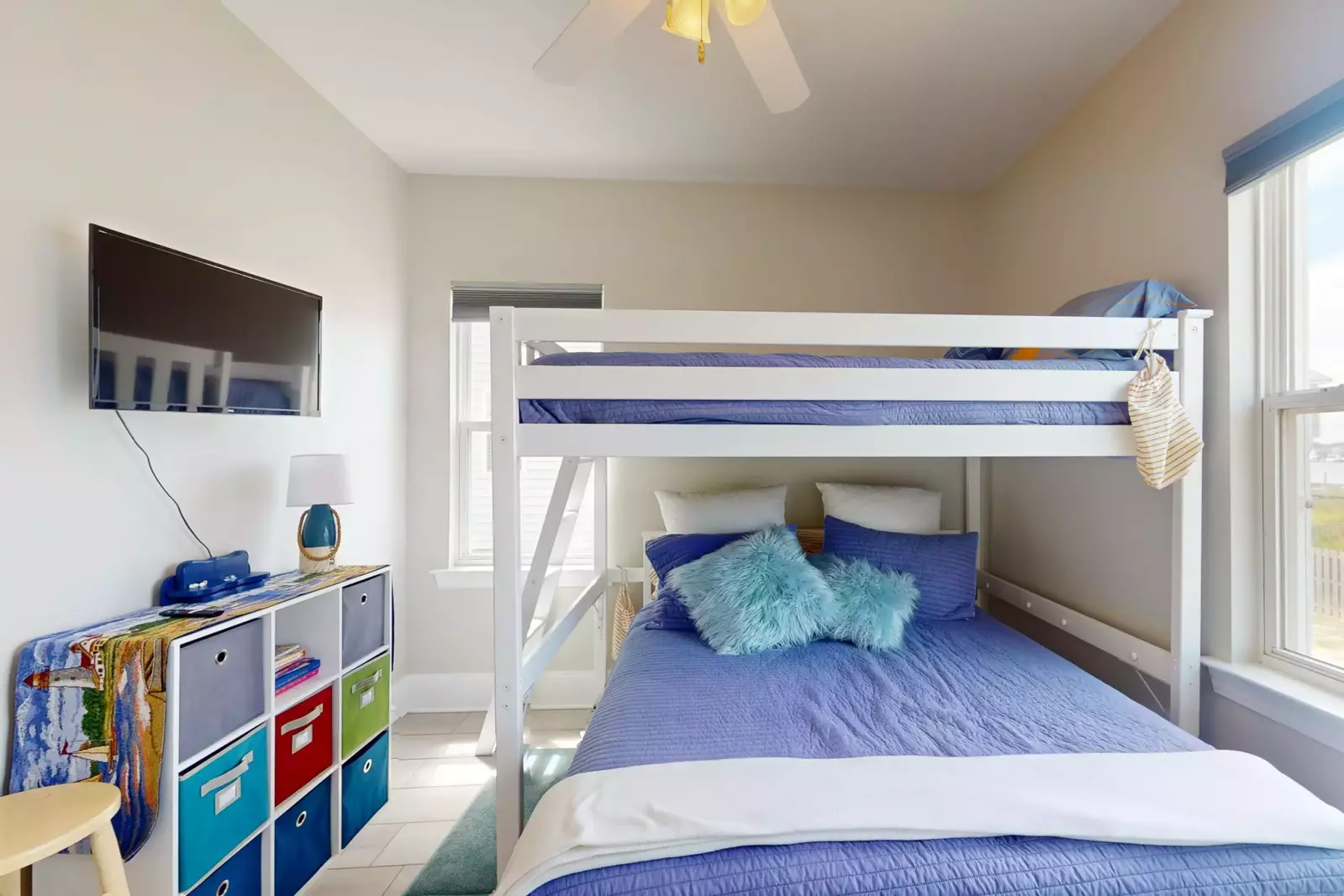 Bunk room with queen bed on the bottom and full bed on the top