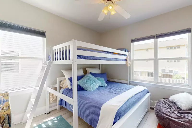 Bunk room has additional seating for watching tv or playing games