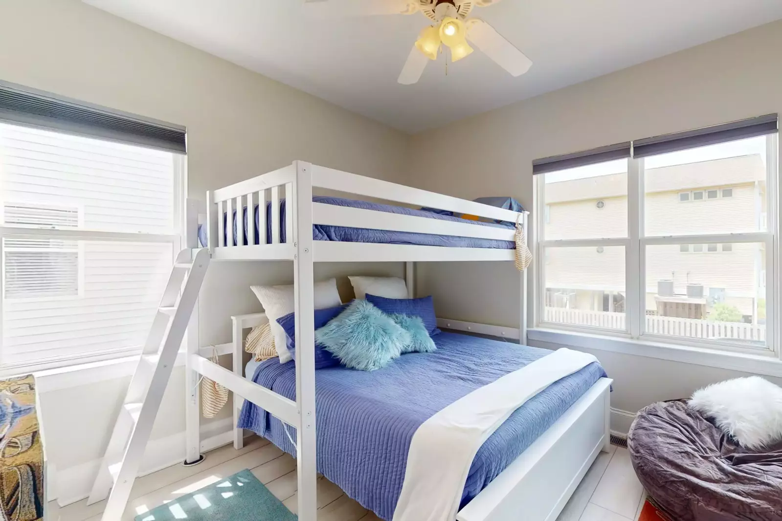 Bunk room has additional seating for watching tv or playing games