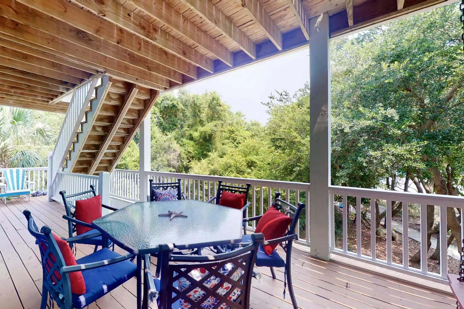 The trees surrounding the home provide plenty of privacy and tranquility while hanging out on the large deck.