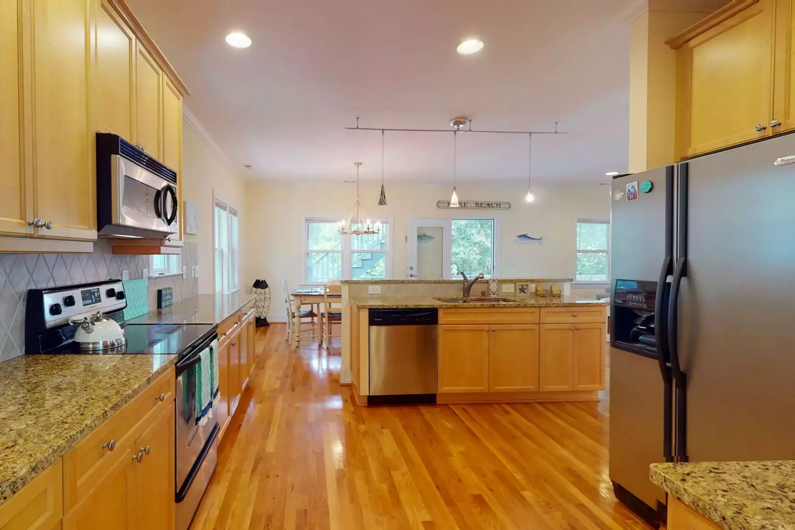 The kitchen includes a large island and updated appliances