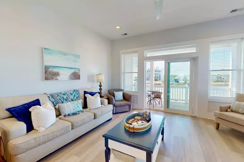 Enjoy comfortable seating with an ocean view from the balcony