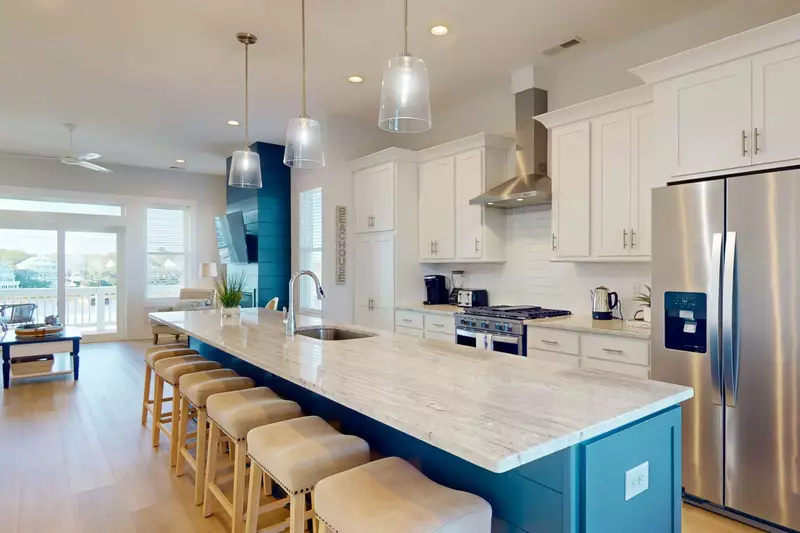 The gourmet kitchen is modern, with updated appliances and fully stocked with all the tools you need to make a great meal