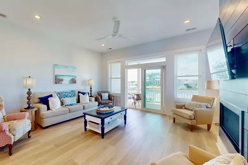 Spacious main living area with flat screen tv and balcony