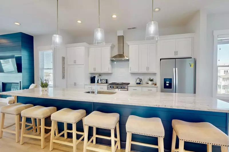 This massive island and high end kitchen provides everything you need for family meals