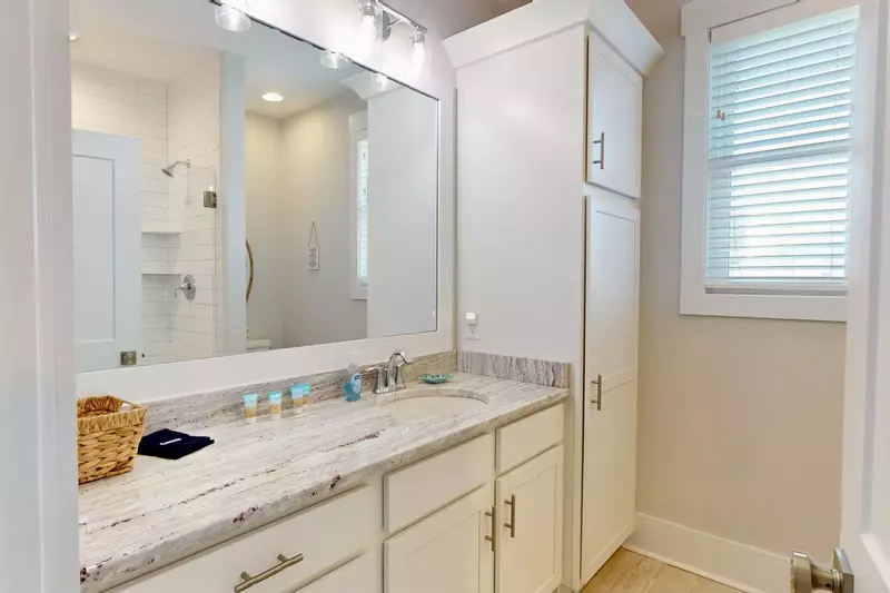 Owner's Suite #1 private bathroom with plenty of storage and a walk in shower.