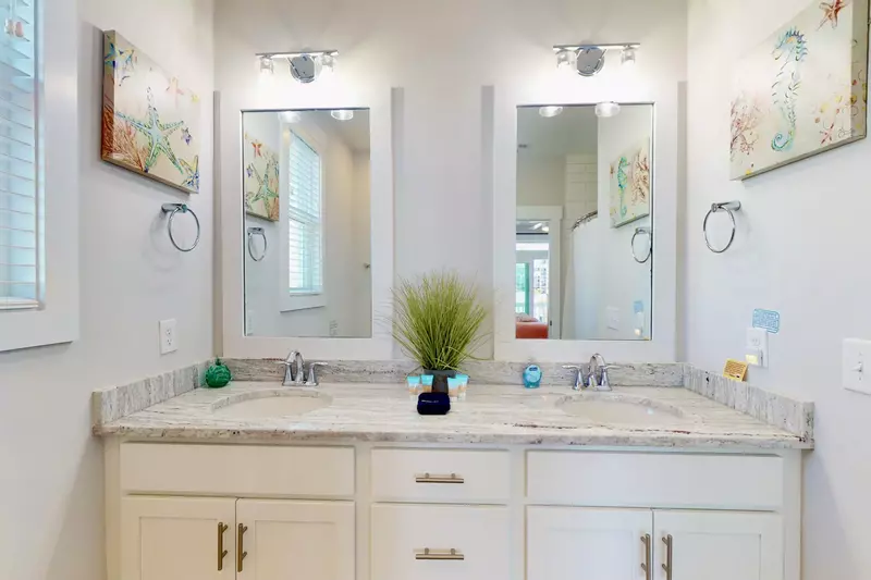 Owner's suite # 3 private bathroom, with double sinks and a walk in shower.