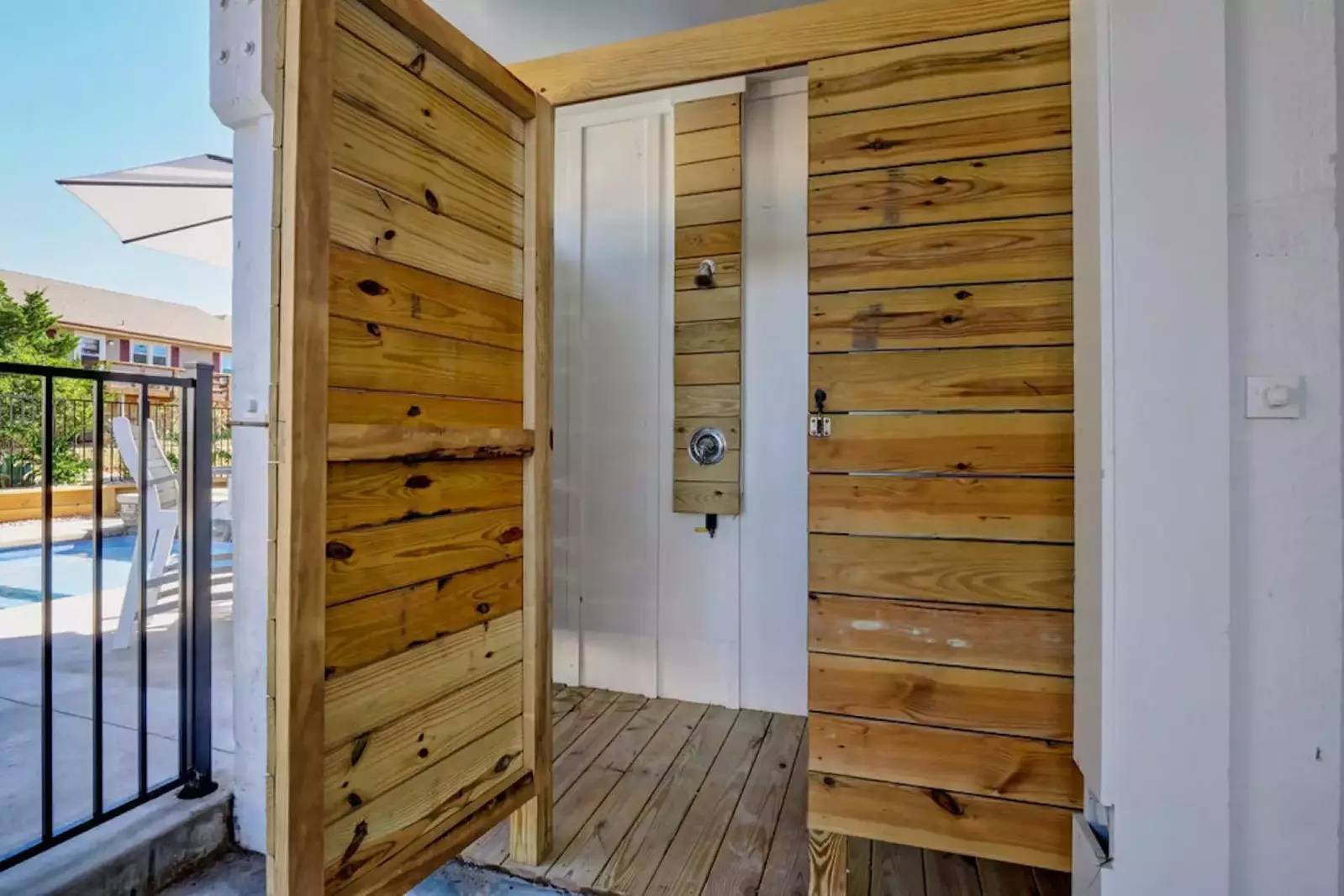 Private, enclosed outdoor shower makes it convenient to rinse off after coming from the beach.