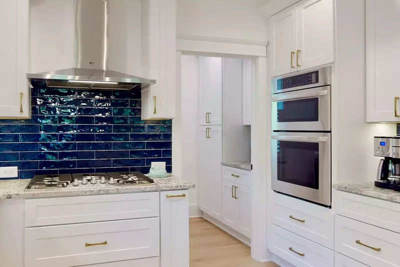 This Must Be The Place gourmet kitchen provides a large gas stove, combo microwave oven and a large oven, next to the coffee station