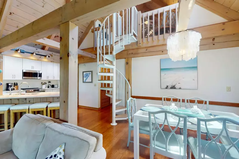 The spiral staircase is a beautiful feature of this tastefully decorated condo