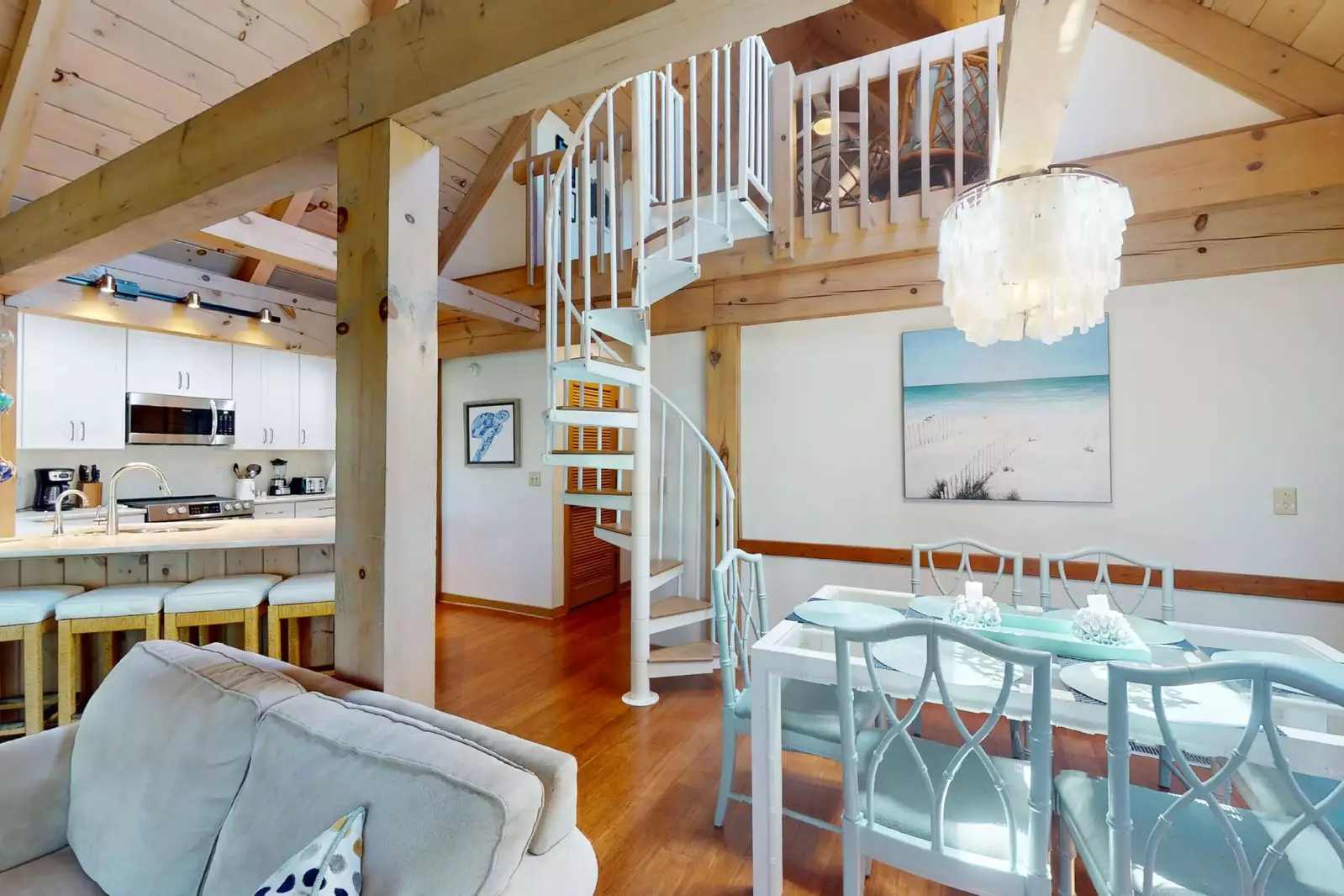 The spiral staircase is a beautiful feature of this tastefully decorated condo