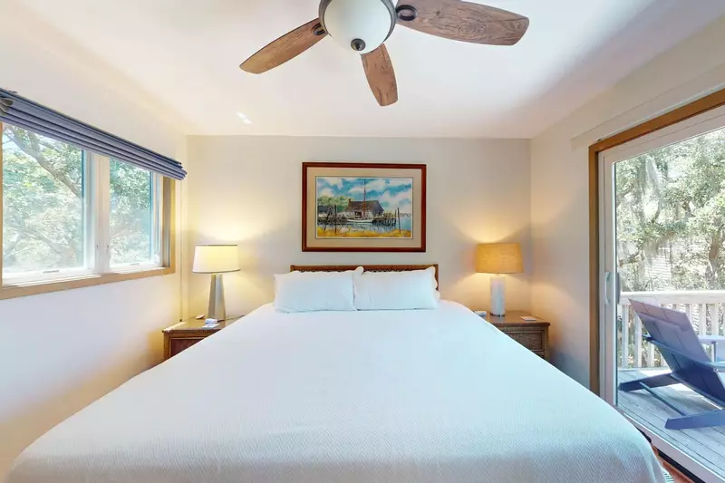 Owner suite features deck access, a king bed and an ensuite bathroom