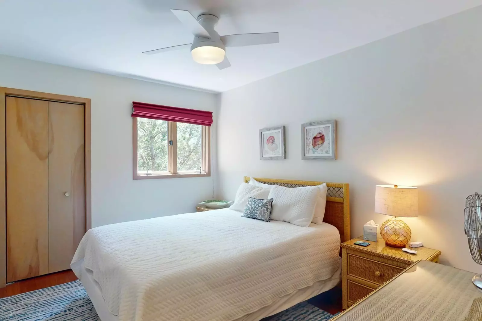 The second bedroom features a queen bed