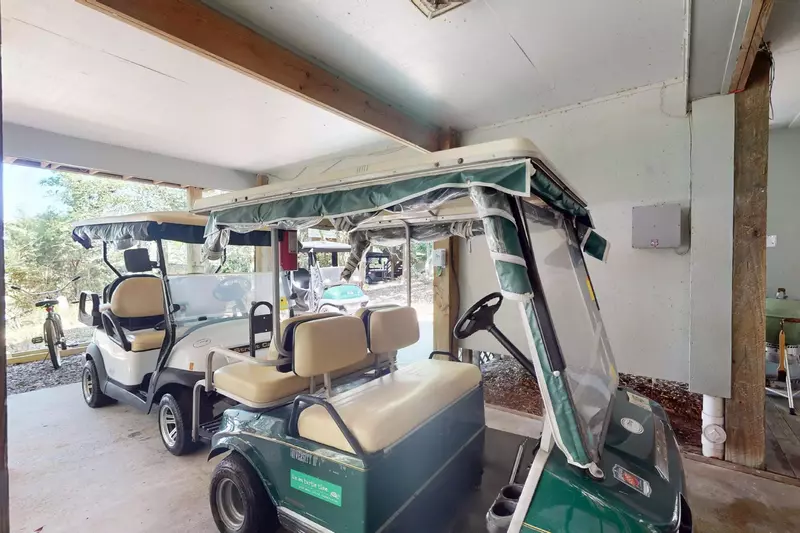 Two four person golf carts