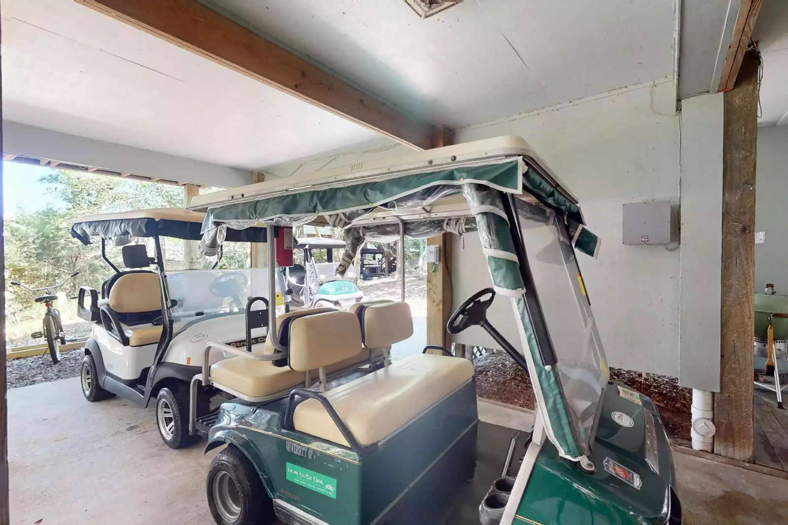 Two four person golf carts