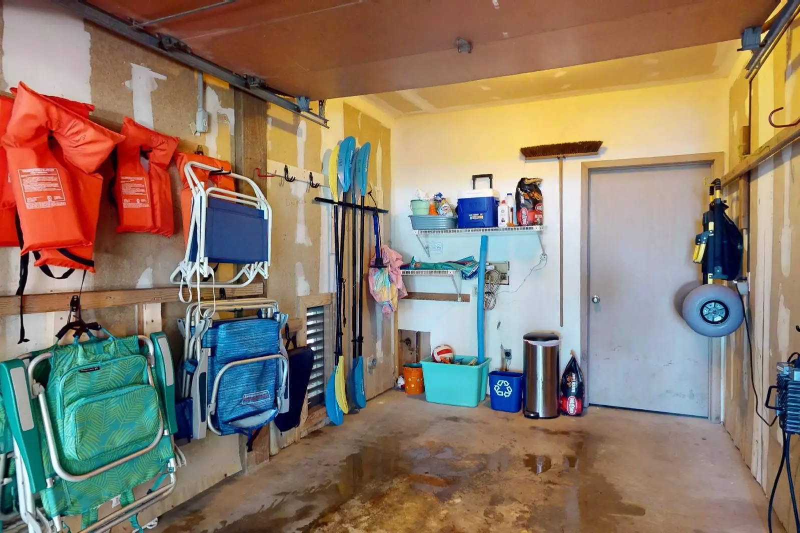 An assortment of beach chairs, life jackets and kayaks for your enjoyment!