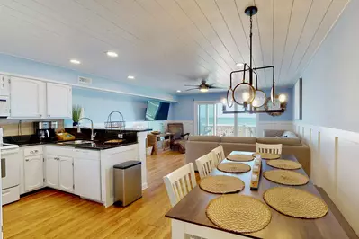 Open concept kitchen, dining and living area