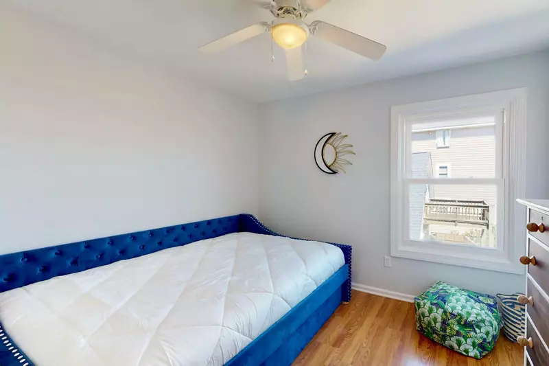 Bedroom 2 features a queen bed with a twin trundle