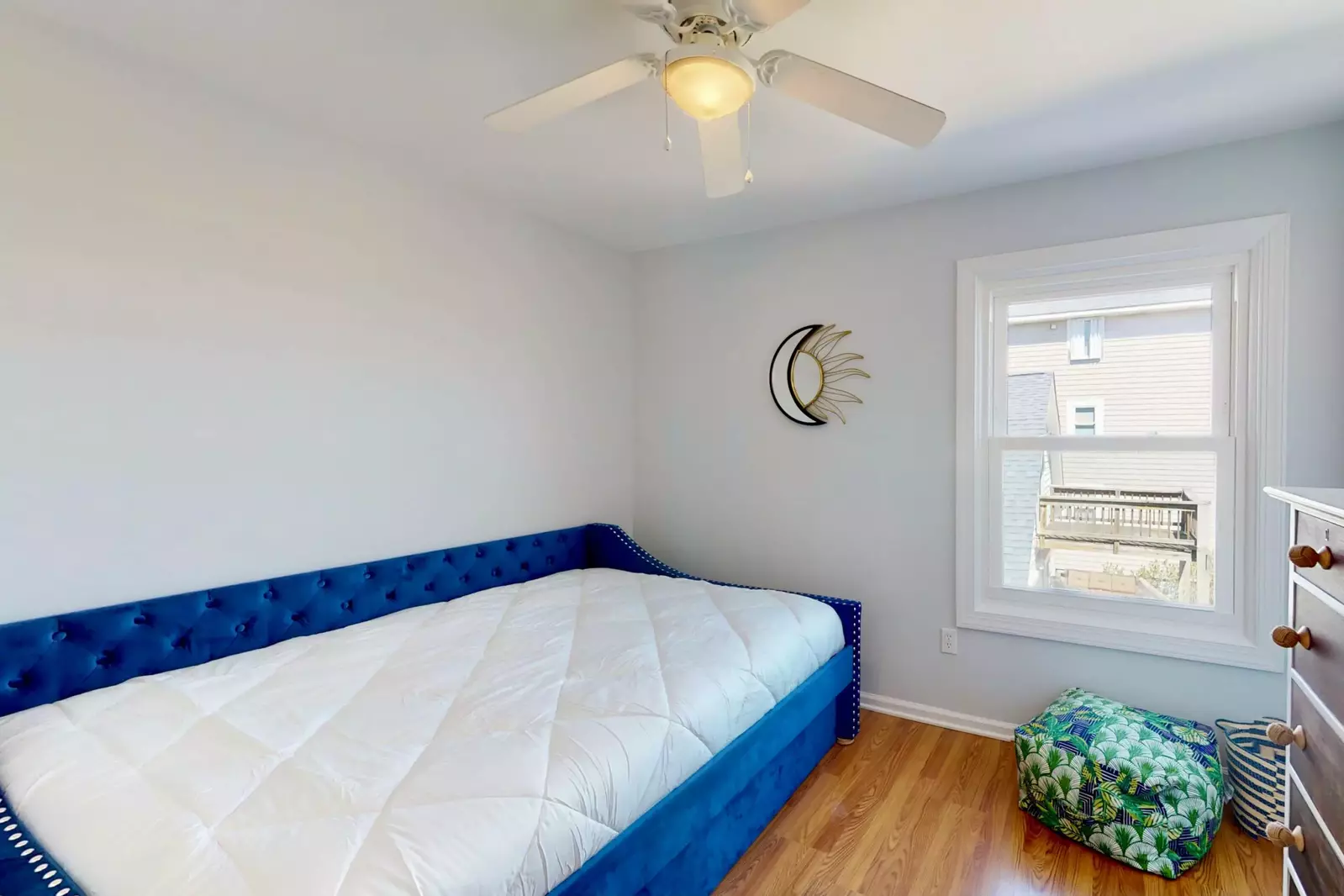 Bedroom 2 features a queen bed with a twin trundle