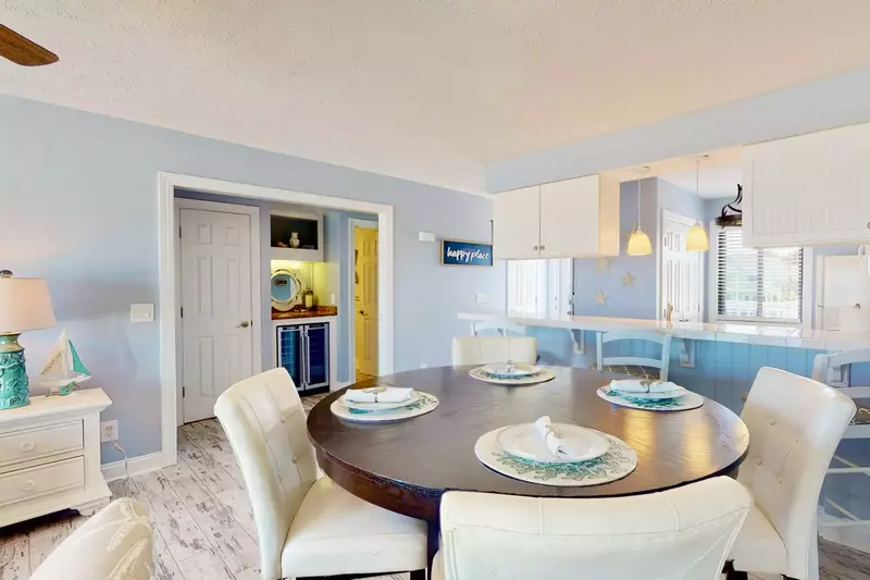 The dining table has very comfortable chairs with an awesome ocean view