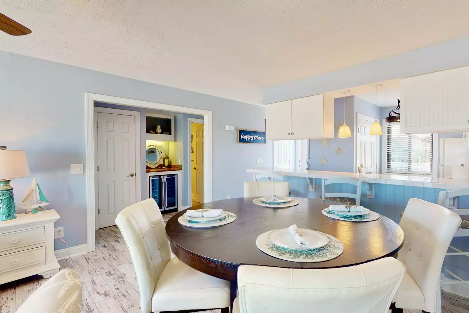 The dining table has very comfortable chairs with an awesome ocean view