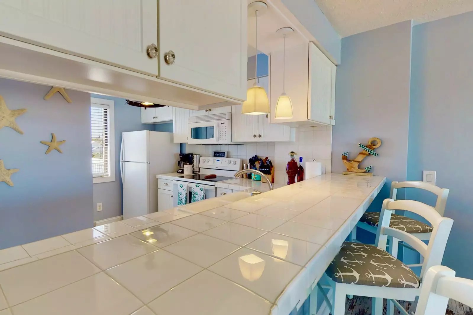 There is a large bar height countertop for additional seating and a great place for morning coffee or breakfast