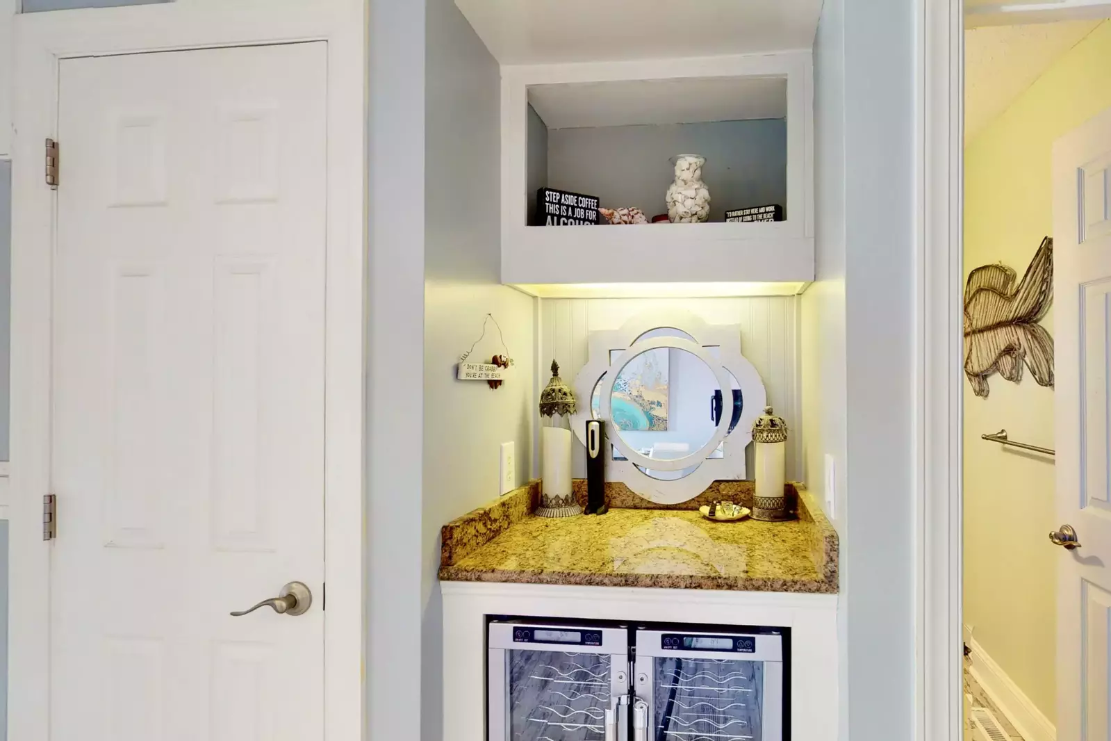 This little bar nook is equipped with a beverage cooler