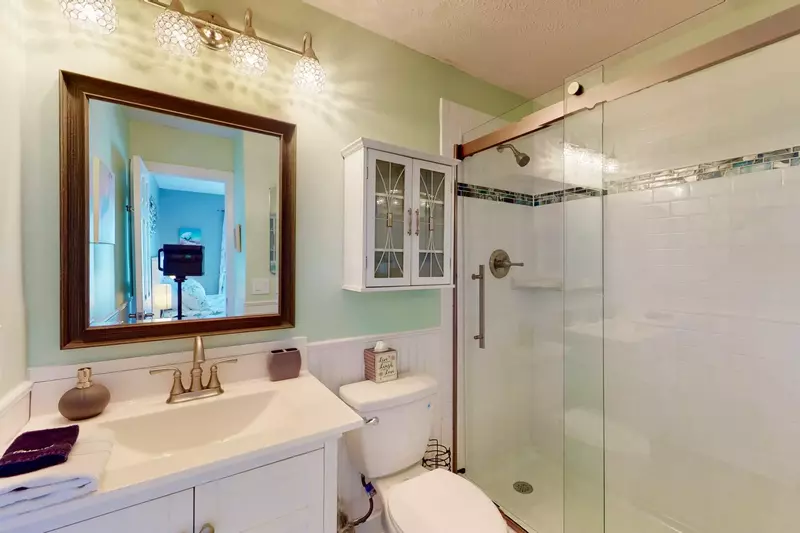 The owner suite bathroom has been completely updated with a large walk in shower
