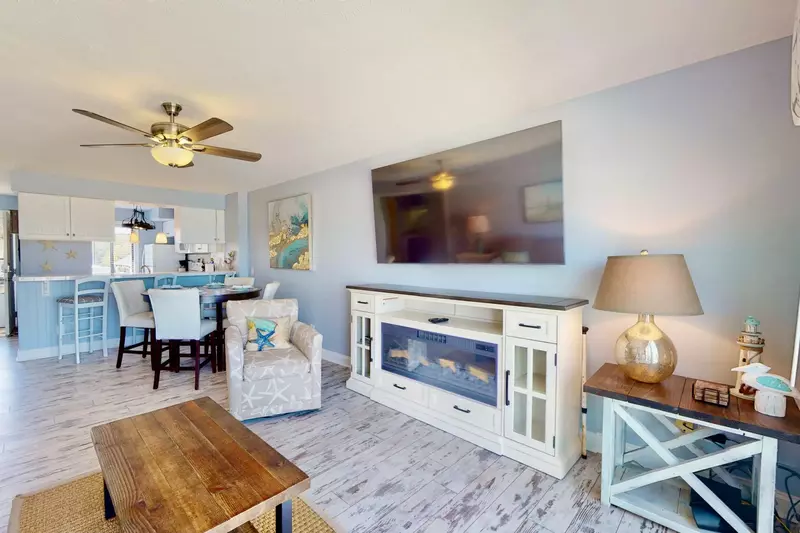 Spacious living area with a view and a large flatscreen tv