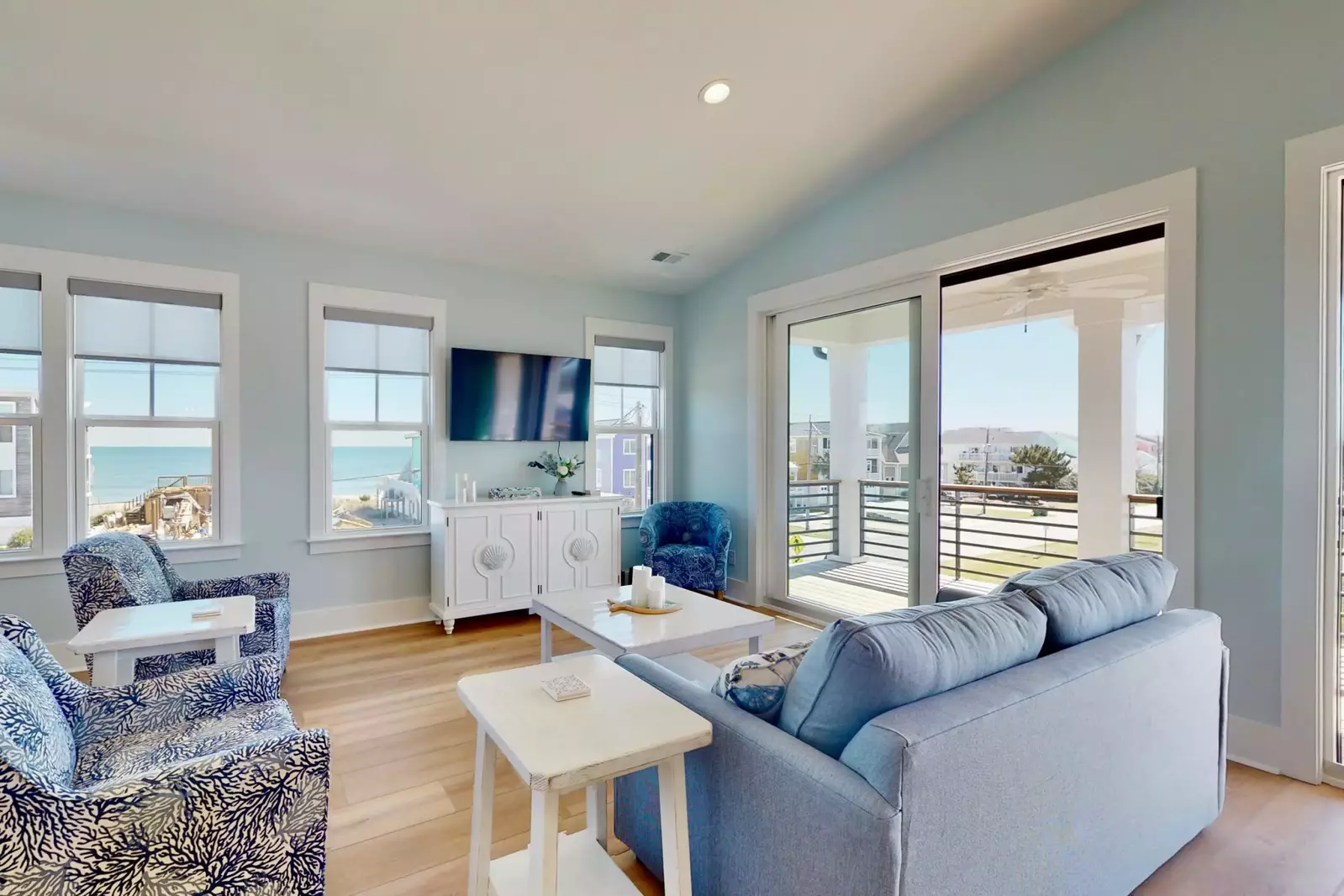 The bright, spacious living room has plenty of space for the entire group with the ocean just out the window!