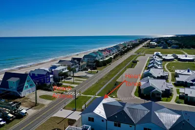 The beach access is conveniently right across from the home. Just a short walk across the street and you're there!