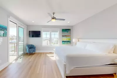 Primary Owner suite with king bed, deck and private bathroom