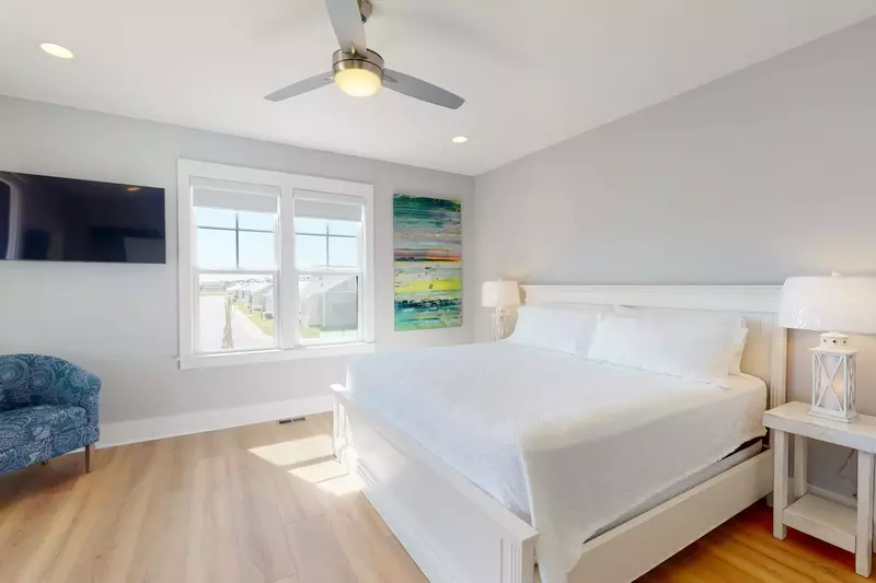 Primary Owner suite with king bed, deck and private bathroom