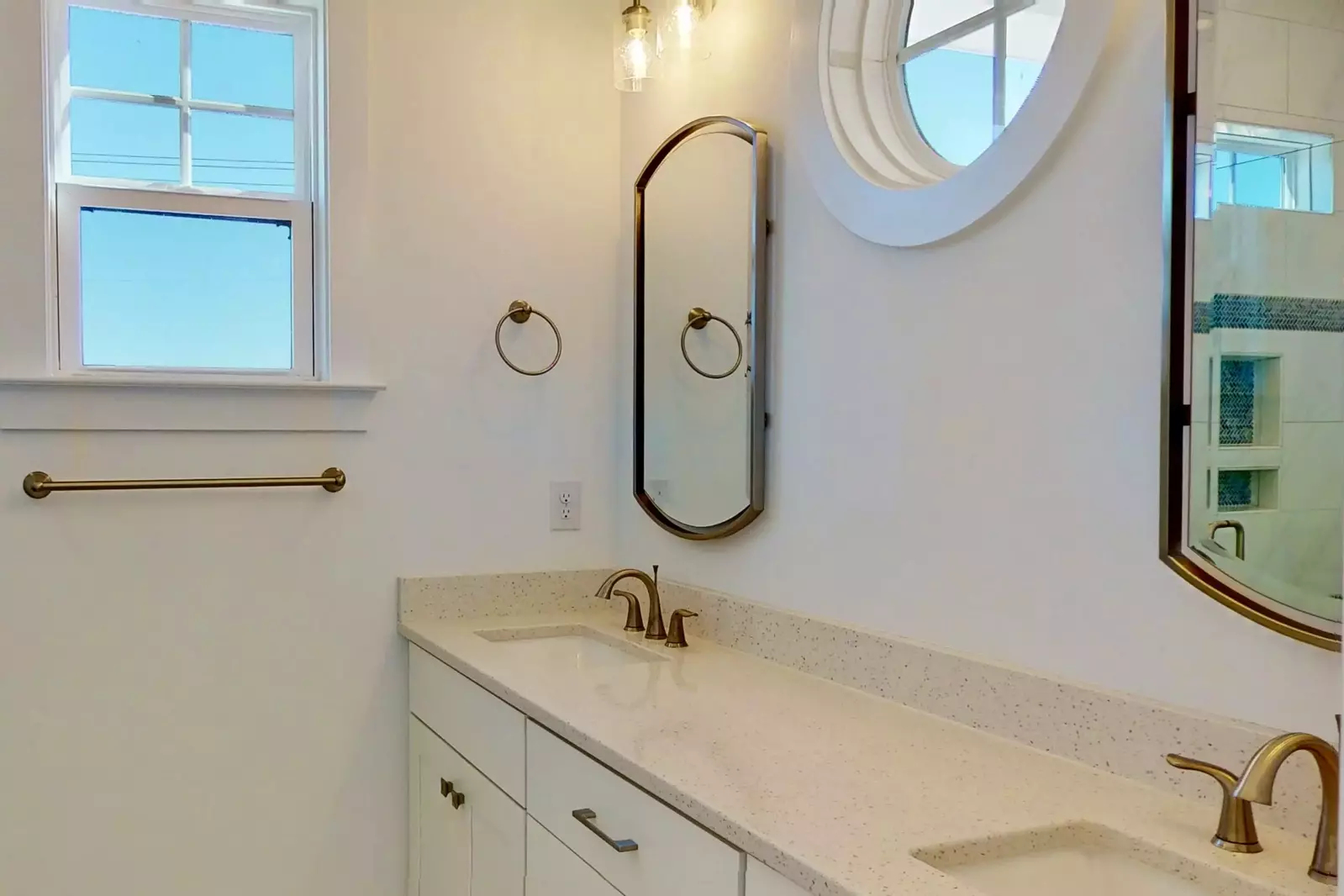 Owners suite bathroom features double vanity sinks, and a large walk in shower