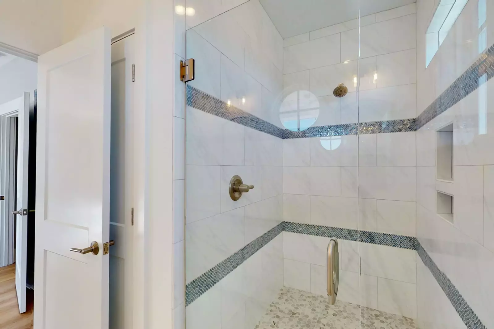 Owners suite bathroom with a huge walk in shower and a separate area for the toilet