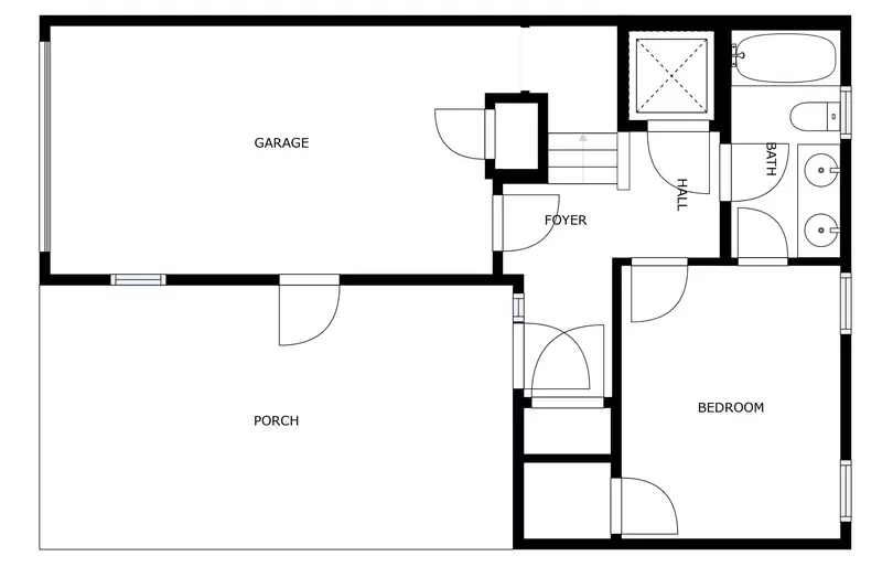 Layout of the first floor, features a garage, and bedroom with an ensuite full bathroom