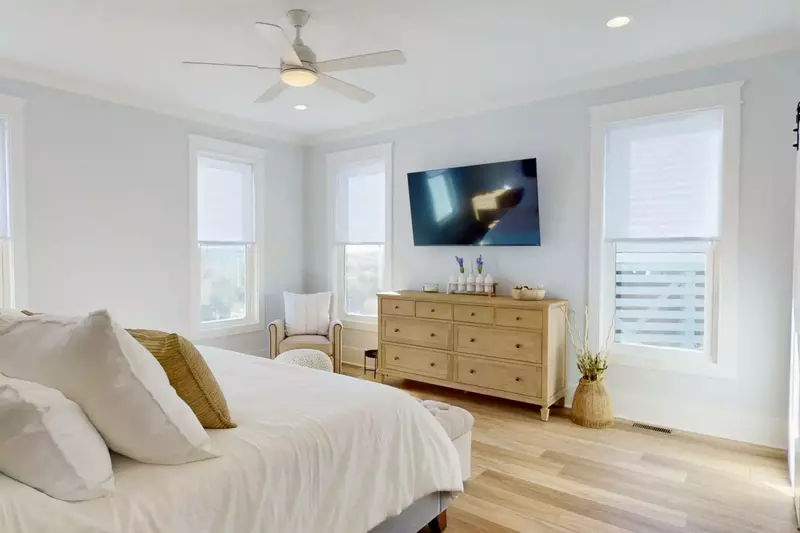 The main suite has a large flat screen TV