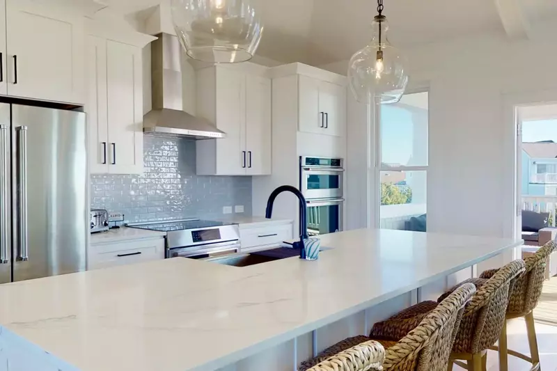 The kitchen has all the tools for any meal and 4 seats are available at the counter