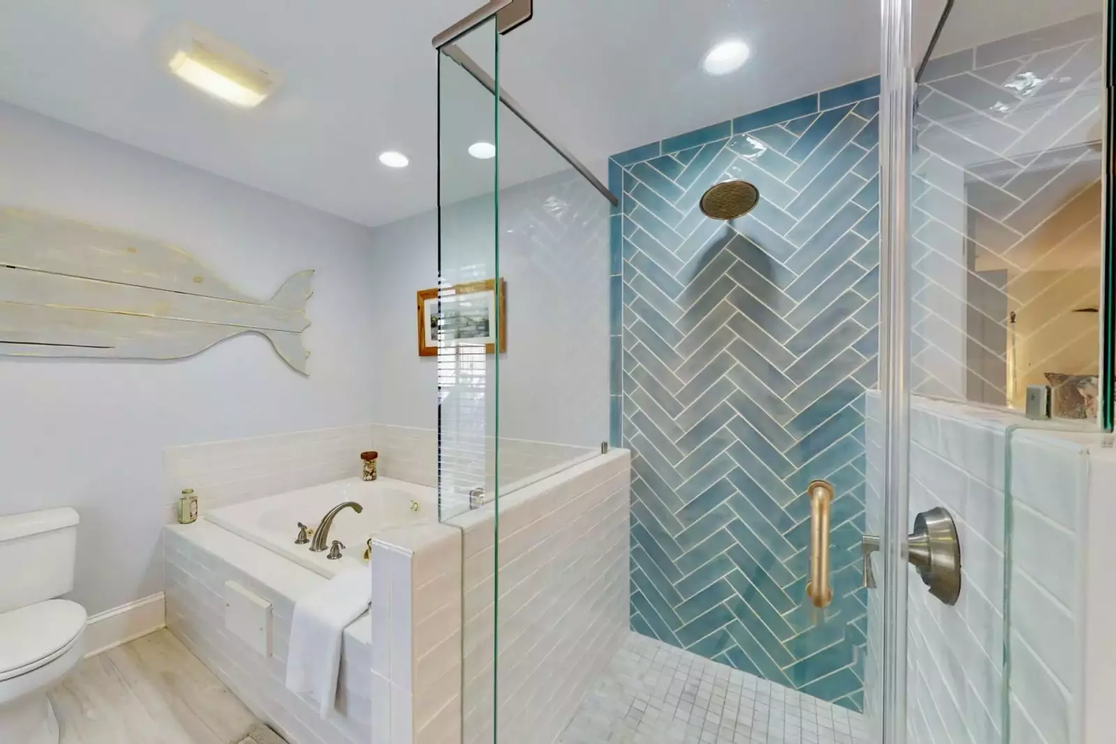 Owner suite with private bathroom has a huge walk in shower and large bathtub