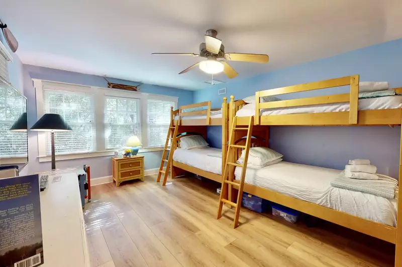 The bunk room has plenty of space and 4 twin beds