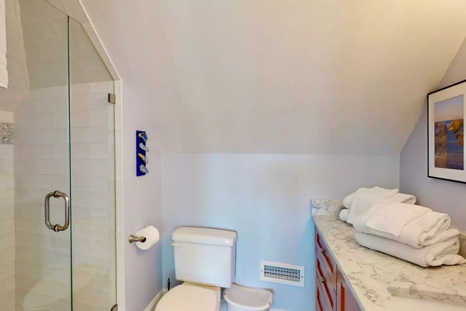 The top floor bedroom has a private full bathroom