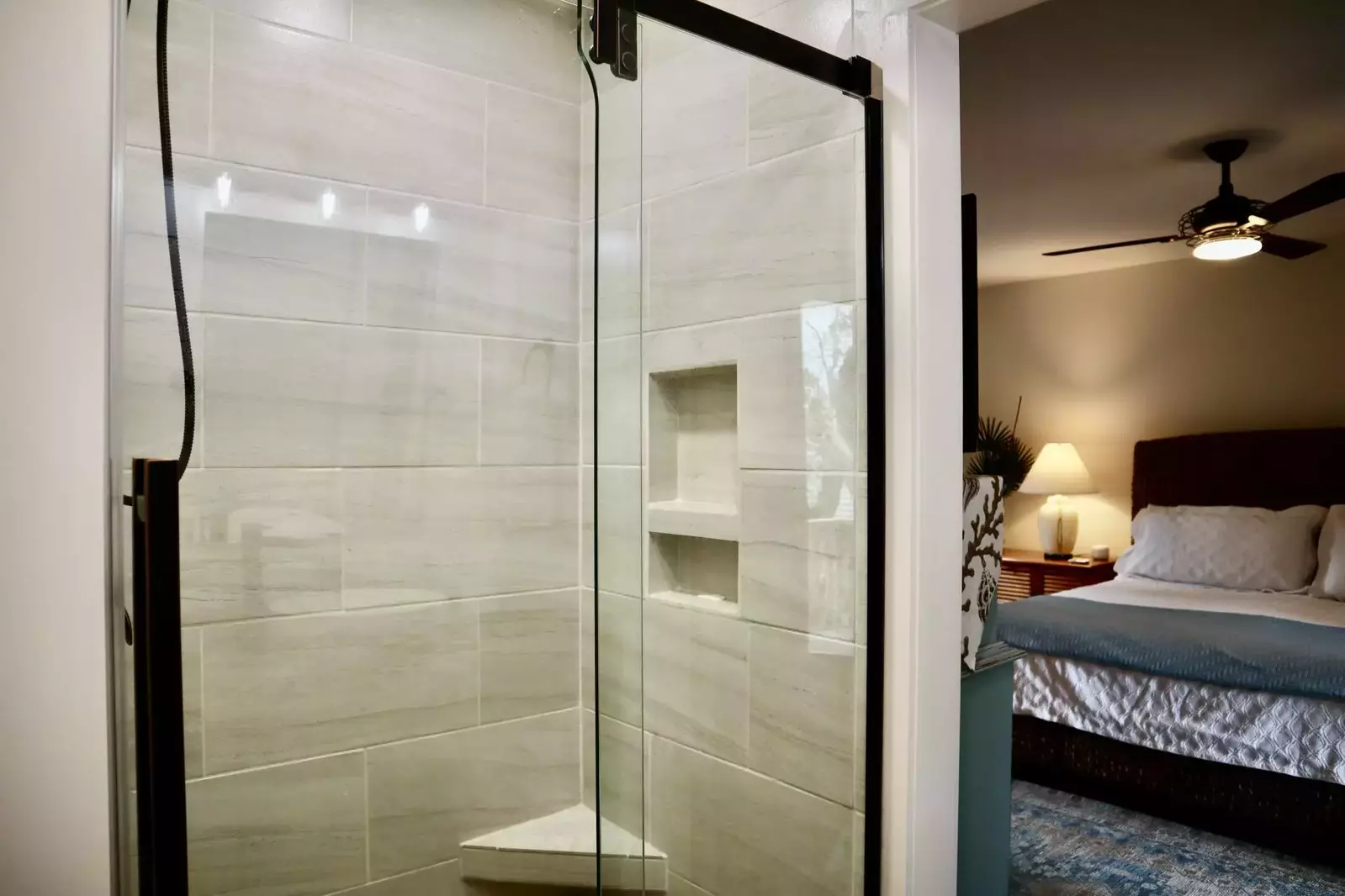 The large walk in tiled shower in the owner suite