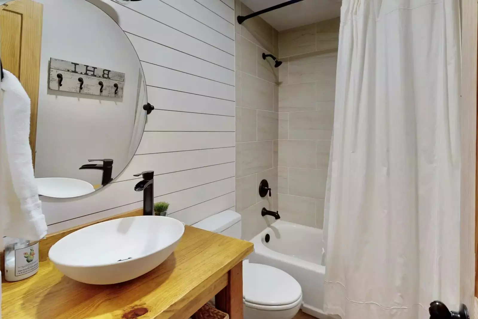 Full hall bathroom right near 2nd and 3rd bedroom with a bathtub