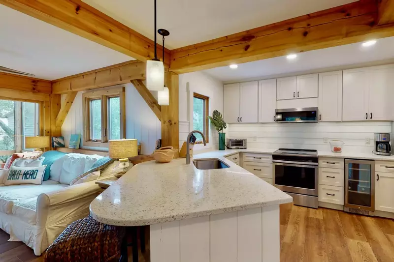 The kitchen counter is spacious and comes with seating