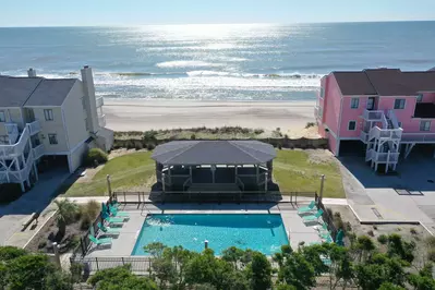 Enjoy the outdoor pool with ocean views and a gazebo. Less than a couple minute walk away!