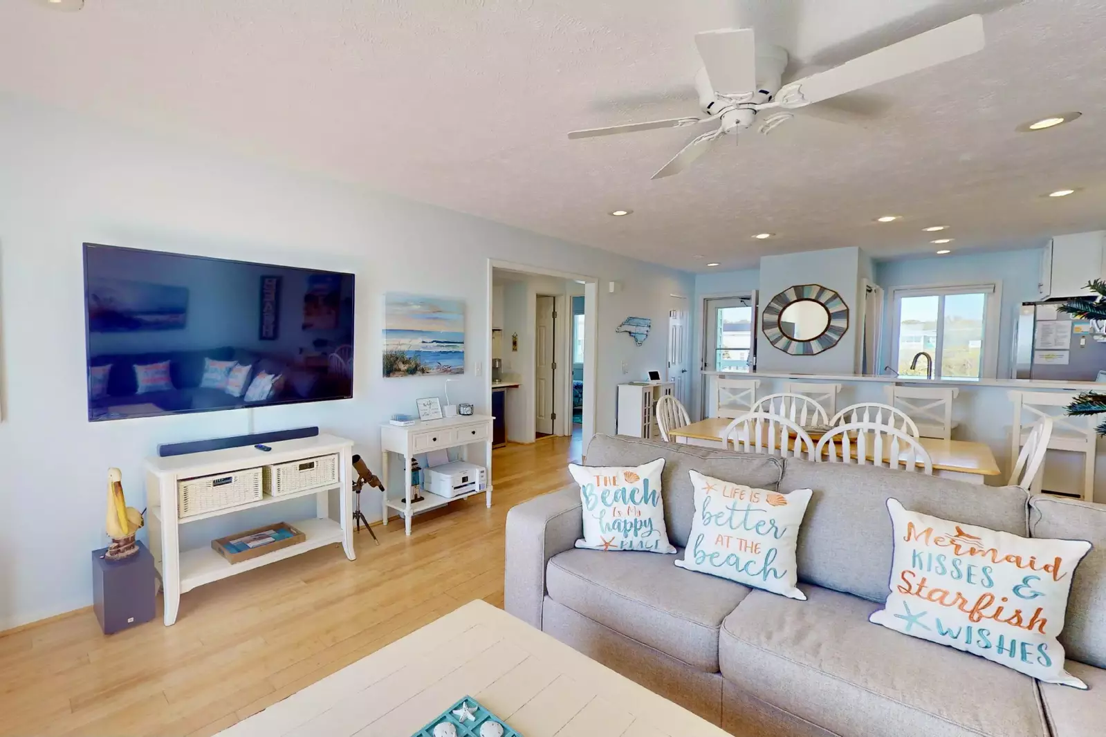 The living room features a large flatscreen tv to watch the big game