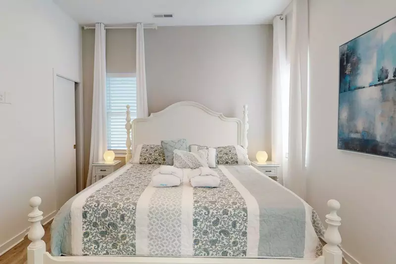 A California King bed and a large private ensuite bathroom create an owner's suite oasis