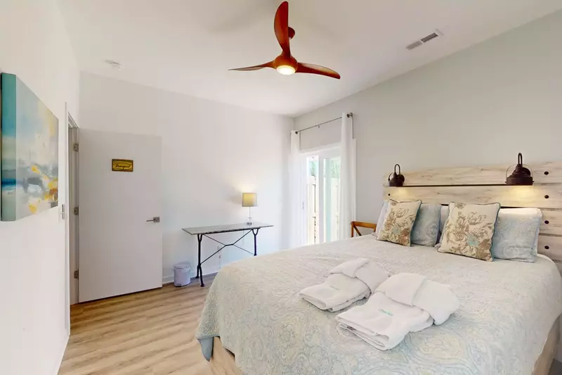 The lovely headboard with mounted lighting make reading in bed a breeze