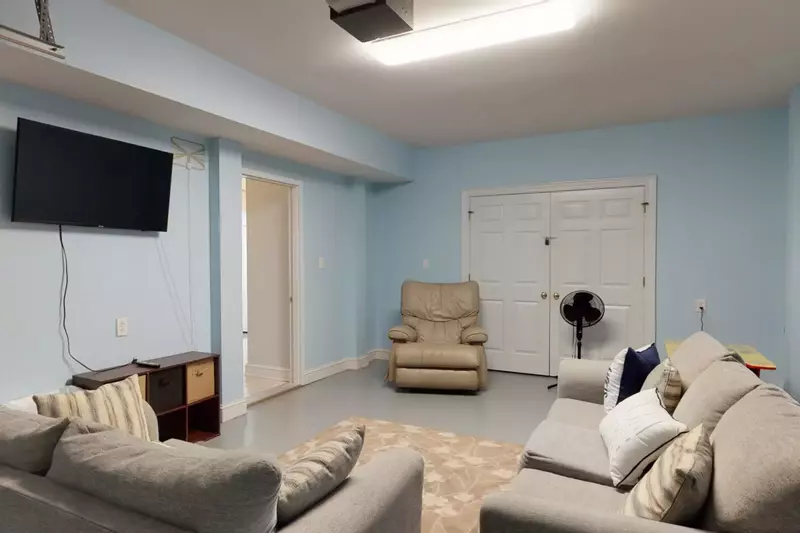 Bottom floor game room. Perfect for the kids to play games and watch TV. This room is not heated or cooled.