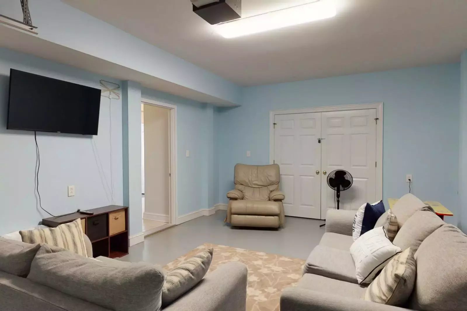 Bottom floor game room. Perfect for the kids to play games and watch TV. This room is not heated or cooled.